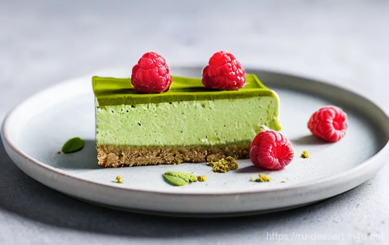 디저트 트렌드 - **Prompt: A beautifully plated, vibrant green vegan matcha cheesecake slice on a light wooden table....
